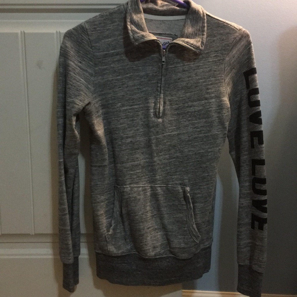 Long sleeve gray pullover, says love on the sleeve
